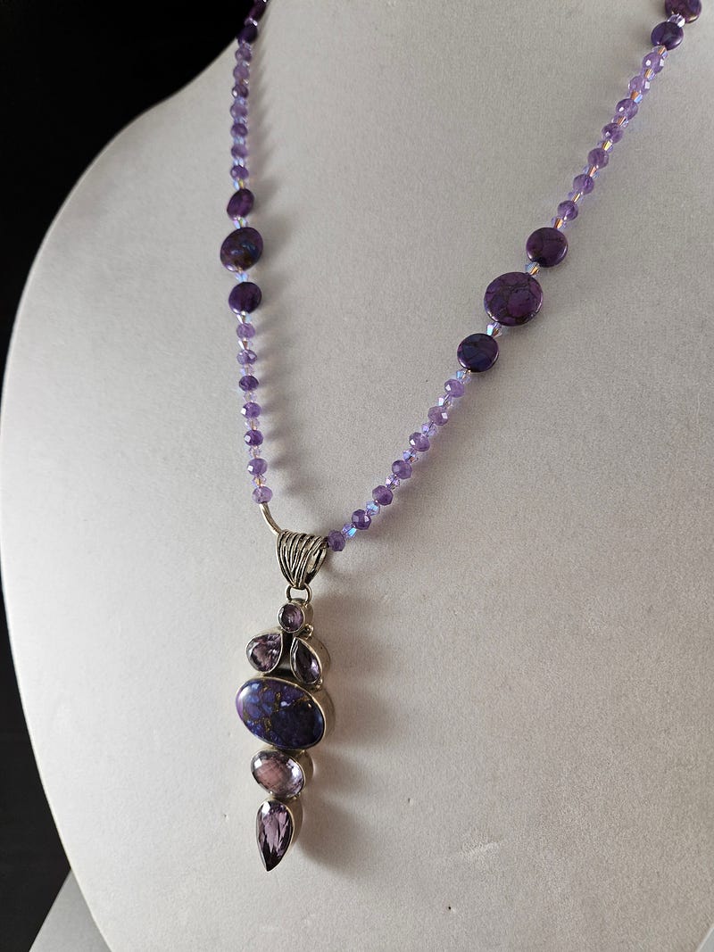 Unique necklace design featuring purple turquoise and amethyst