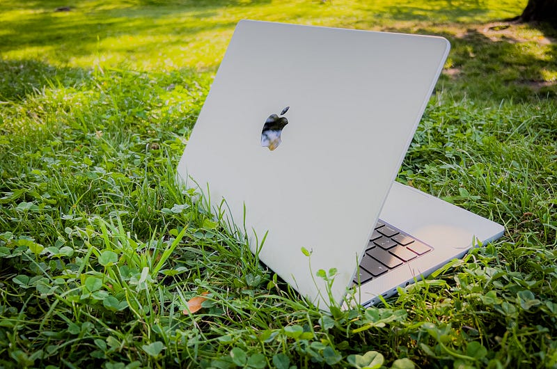 A sleek Apple workspace featuring multiple devices