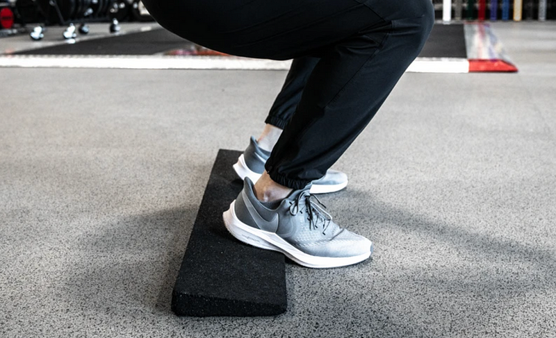 Using heel lifts for squatting