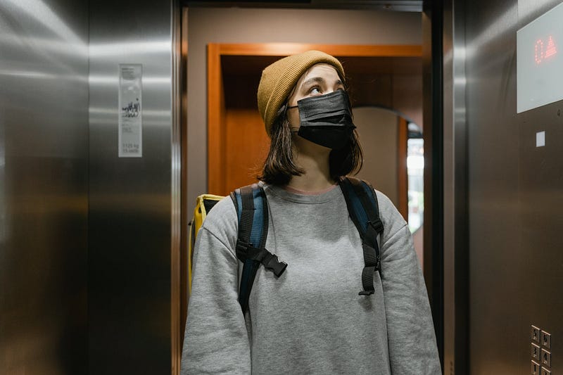 A group of strangers in an elevator