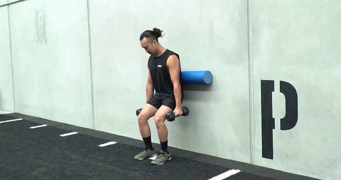 Wall-Assisted Squats Exercise Demonstration