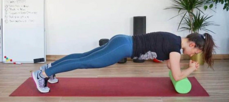 Demonstration of Foam Roller Plank exercise